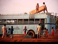 Children packing Auroville bus for a trip