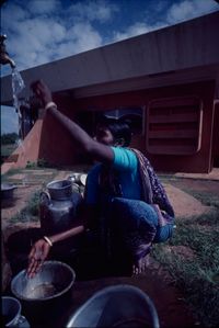 Djaima - washing dishes outside